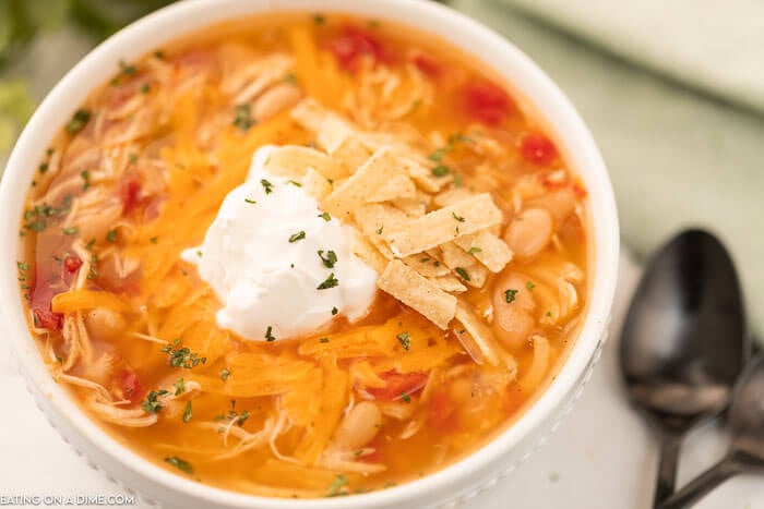 Bowl of Instant Pot Chicken taco Soup topped with sour cream. 