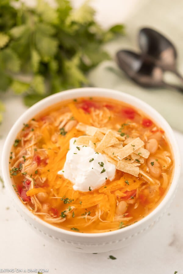 Bowl of Instant Pot Chicken taco Soup topped with sour cream. 
