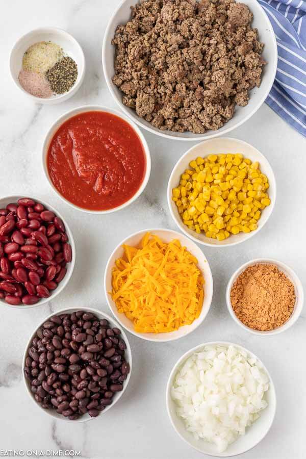 Ingredients for recipe: corn, cheese, seasoning, beans, onion, tomatoes. 