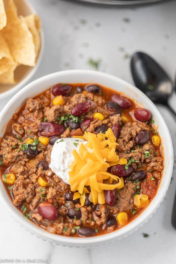 Bowl of taco soup with sour cream and cheese. 