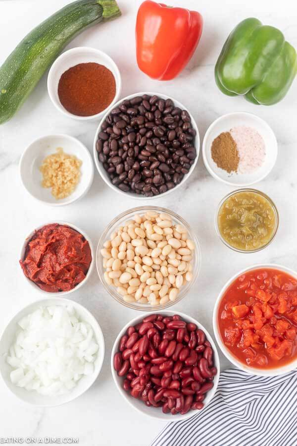 Ingredients needed for vegetarian chili  - zucchini, onion, green bell pepper, jalapeno pepper, diced tomatoes, tomato paste, kidney beans, black beans, minced garlic, chili powder, salt and cumin