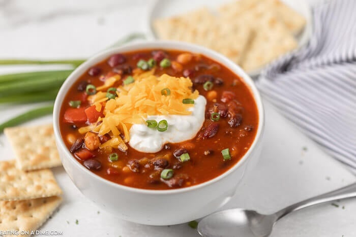Close up image of vegetarian chili in a white bowl. 