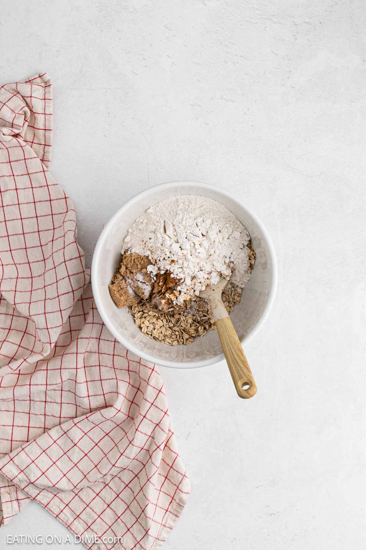 Crumble topping ingredients mixed together in a bowl. 