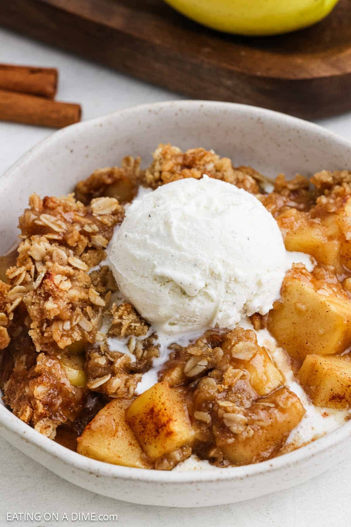 Bowl of apples and topping served with ice cream. 