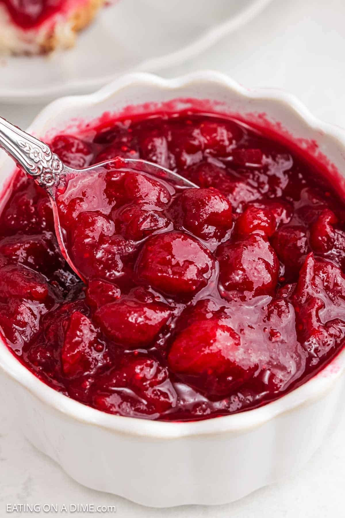 Red sauce in a white bowl.