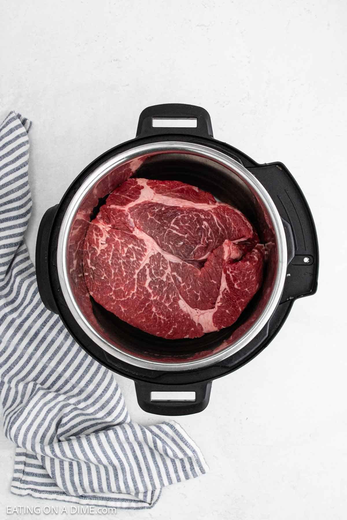Roast placed in the instant pot.