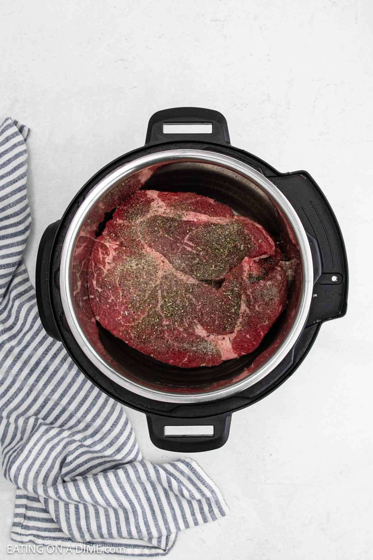 Seasoning added to the top of the roast in the instant pot.