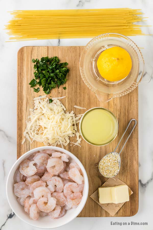 Ingredients needed - butter, shrimp, salt and pepper, garlic salt, lemon, chicken broth, fresh parsley, parmesan cheese and angel hair pasta. 