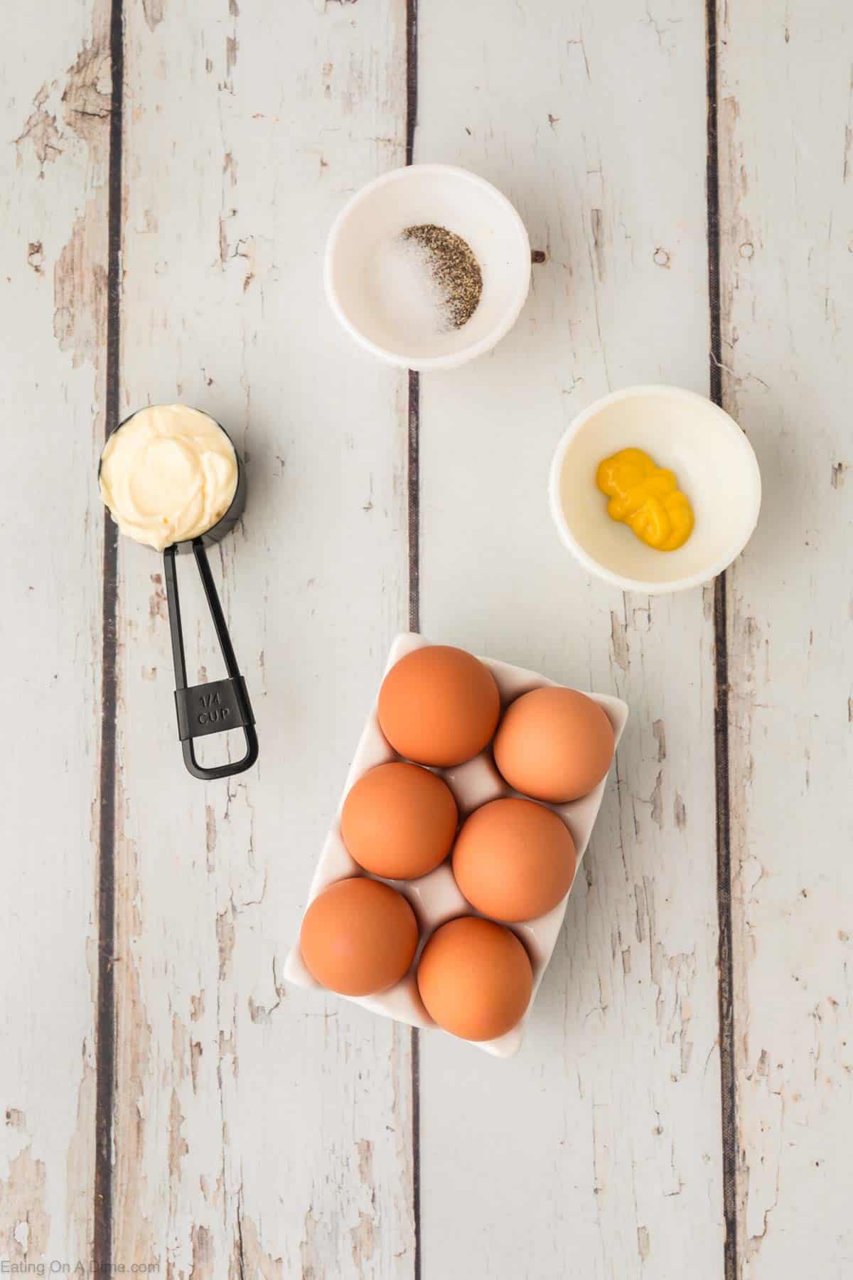 Deviled Eggs ingredients - hard boiled eggs, mayonnaise, mustard, salt and pepper, paprika