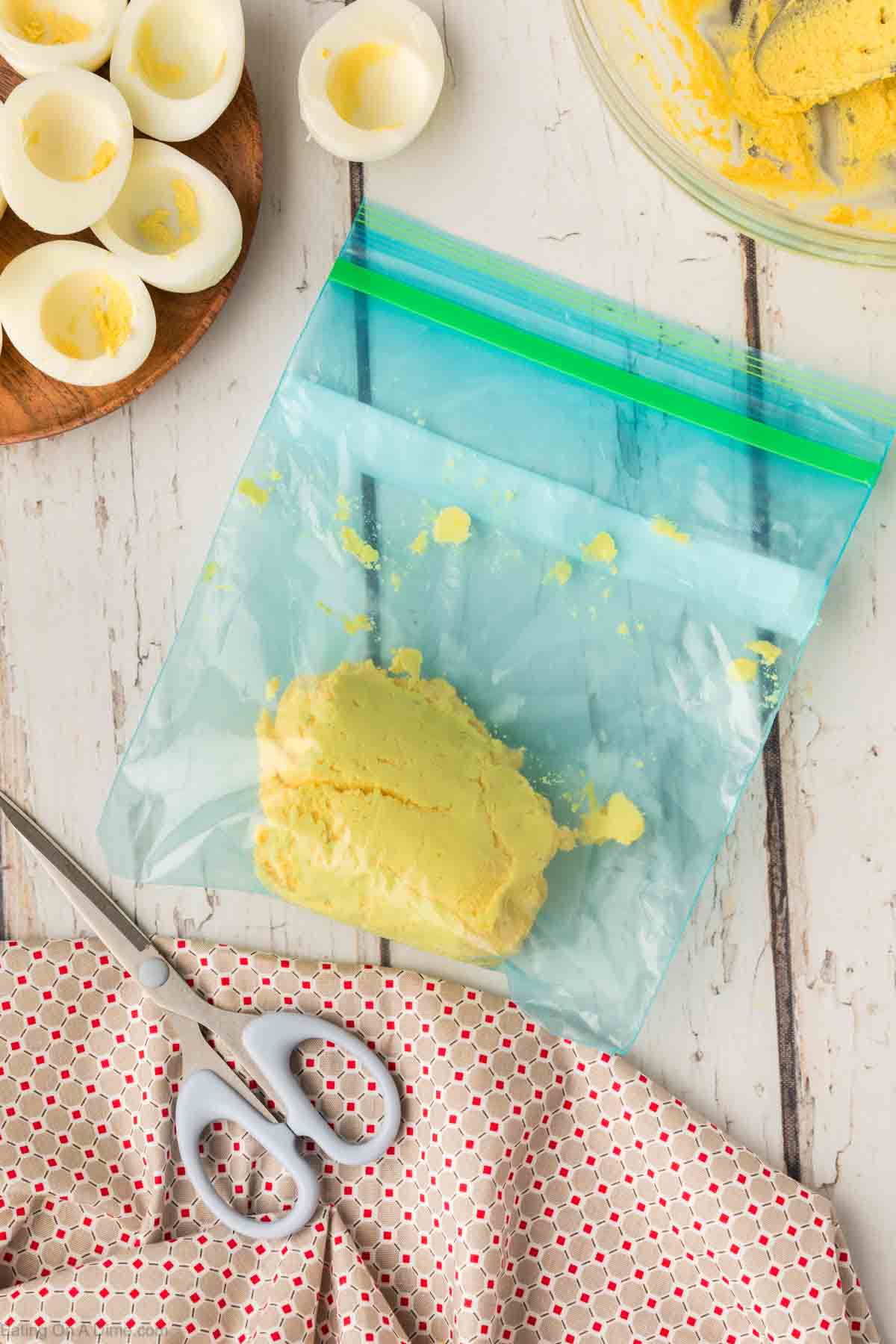 Placing egg yolk mixture in a ziplock bag