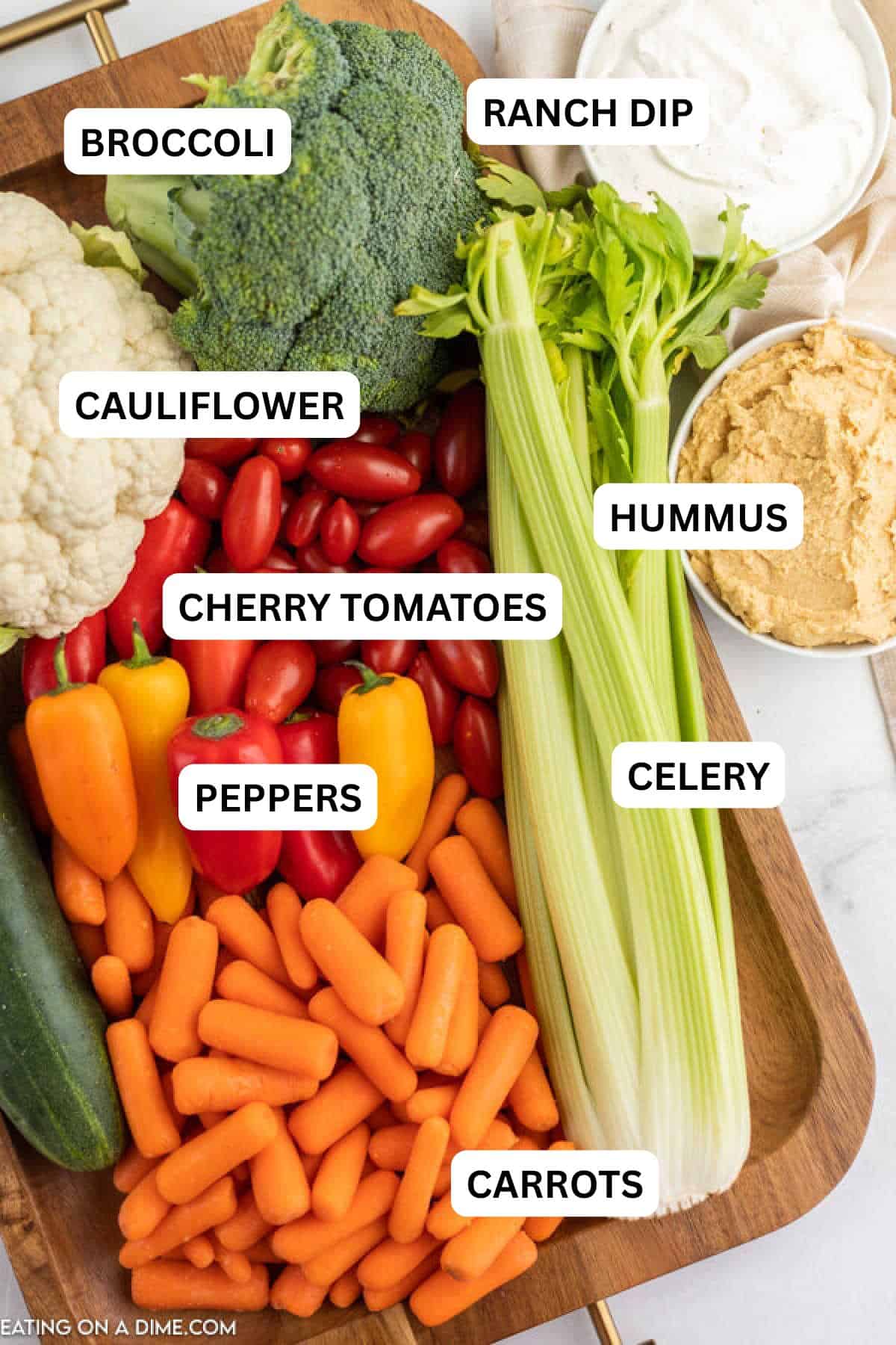 Ingredients needed for this recipe: baby carrots, celery, cucumbers, cherry tomatoes, broccoli, cauliflower and bell peppers.