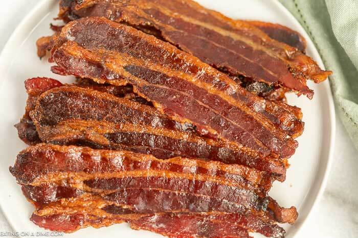 Candied bacon on a plate.