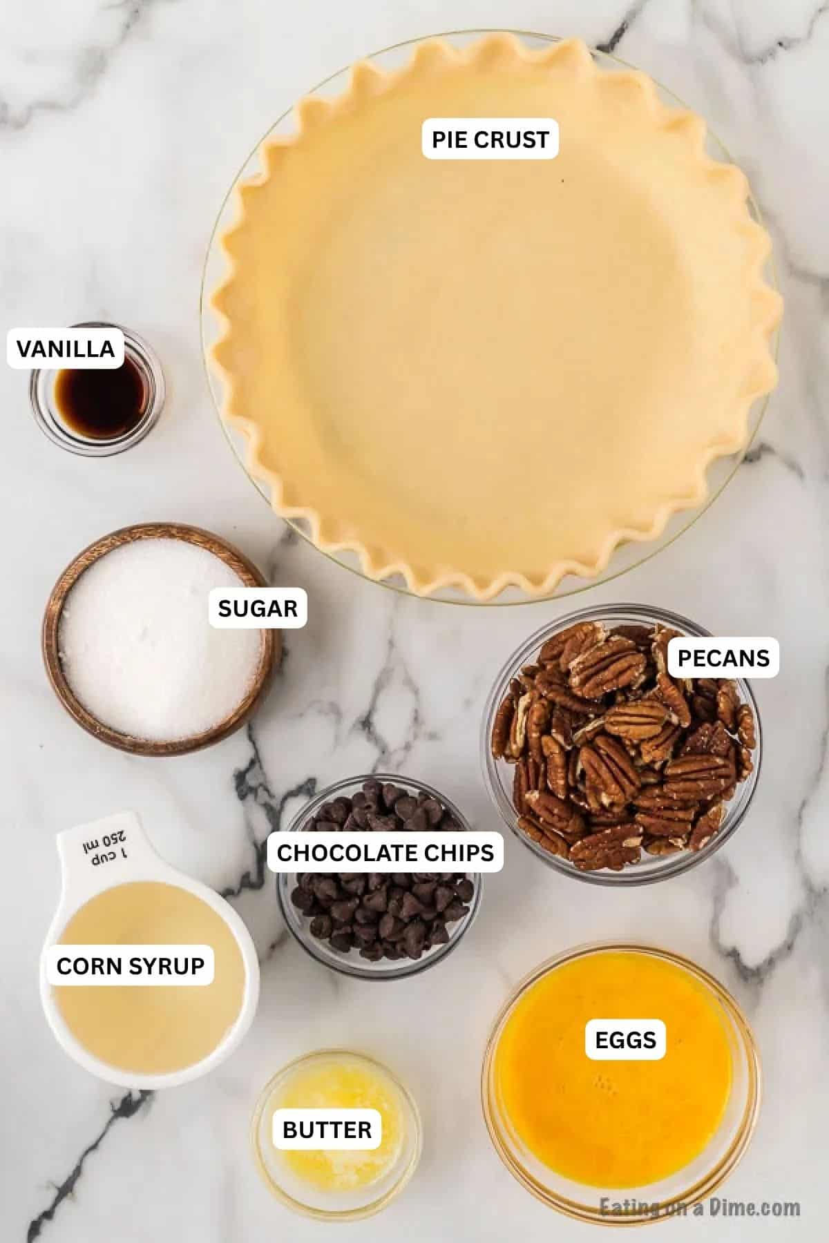 Ingredients for recipe: pie crust, vanilla, sugar, pecans, chocolate chips, corn syrup, eggs and butter
