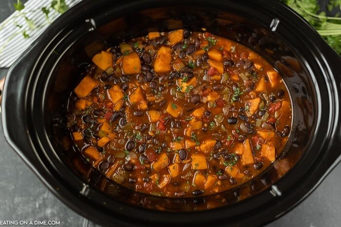 Close up image of sweet potato black bean chili in a crock pot. 
