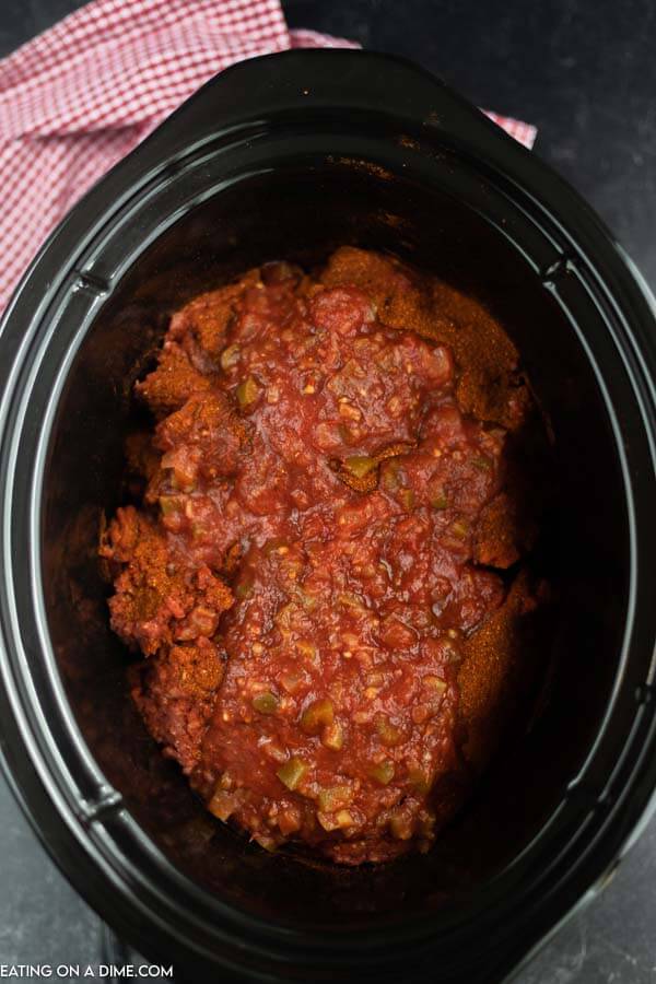 Close up image of taco meat in process in the crock pot. 