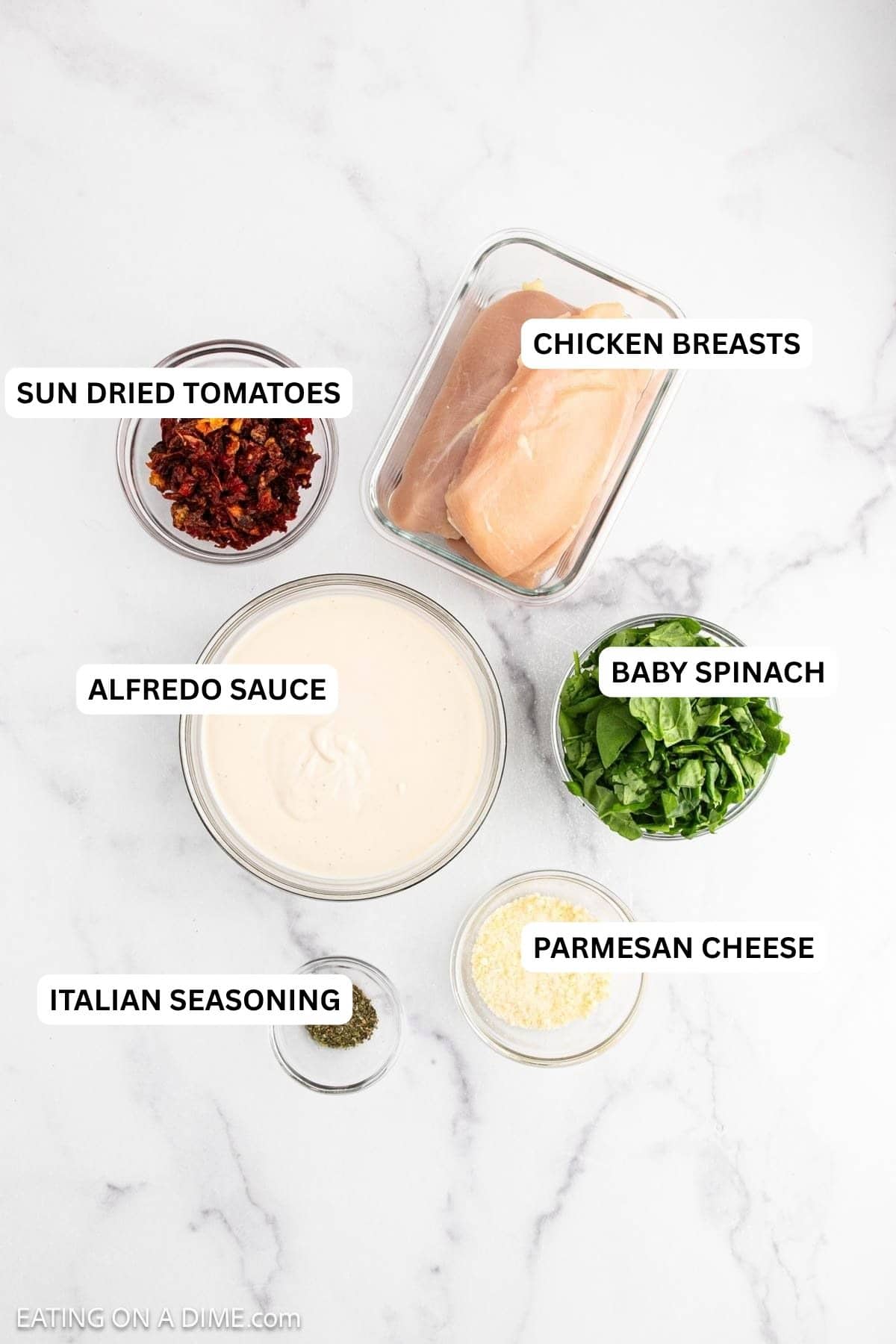 Ingredients for recipe: Parmesan cheese, Italian seasoning, alfredo sauce, baby spinach, chicken breasts and sun dried tomatoes.