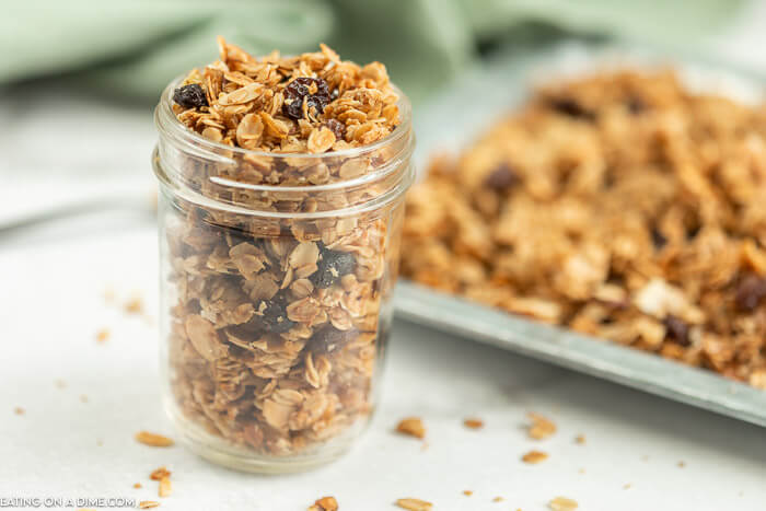 Close up image of granola in a mason jar. 