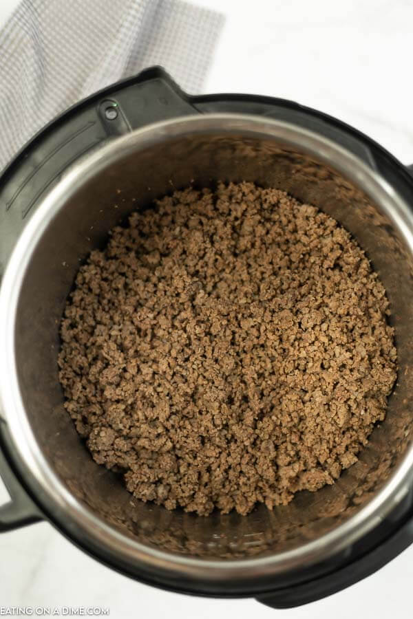Close up image of ground beef in an instant pot. 