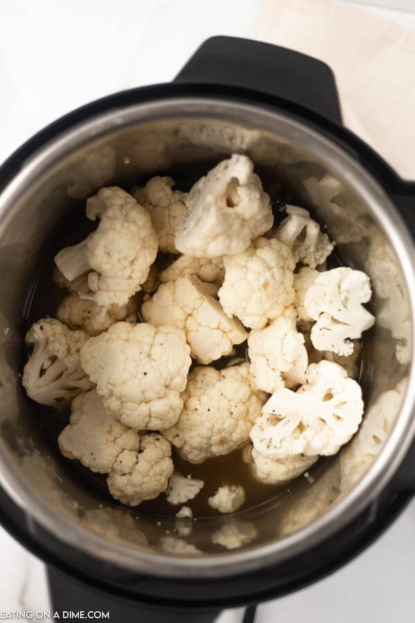 Close up image of cauliflower florets in a instant pot. 