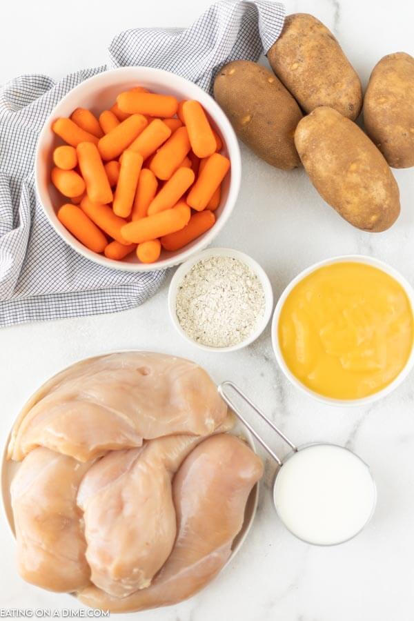 Ingredients needed - chicken, potatoes, baby carrots, ranch seasoning mix, cream of chicken soup and milk. 