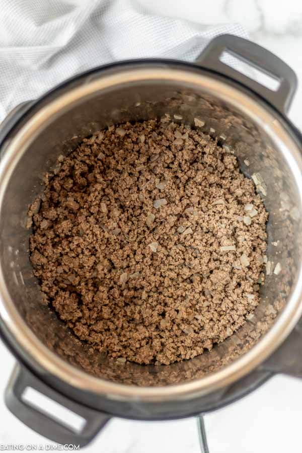 Browned ground beef in the pressure cooker. 