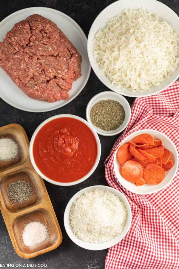Ingredients needed for pizza casserole - beef, salt and pepper, mozzarella cheese, crushed tomatoes, italian seasoning, garlic salt parmesan cheese