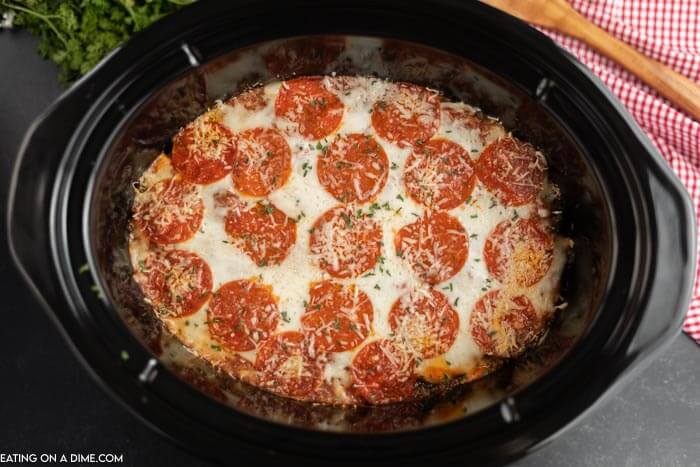 close up image of pizza casserole in the crock pot. 