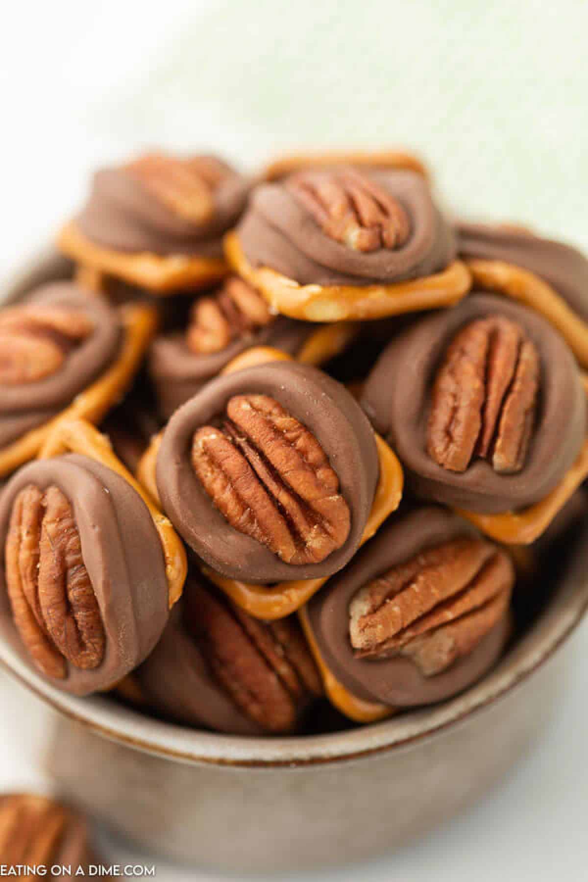bowl of pecan rolo pretzels piled high.