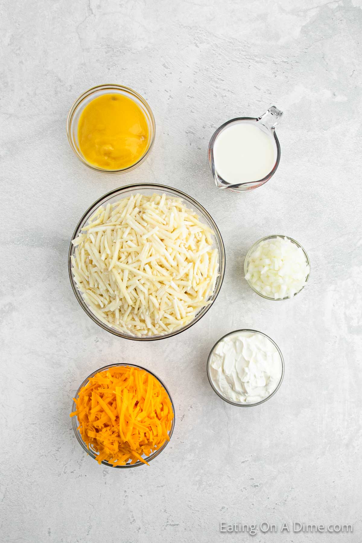 Ingredients - frozen shredded hashbrowns, cream of chicken soup, milk, onion, cheddar cheese, sour cream