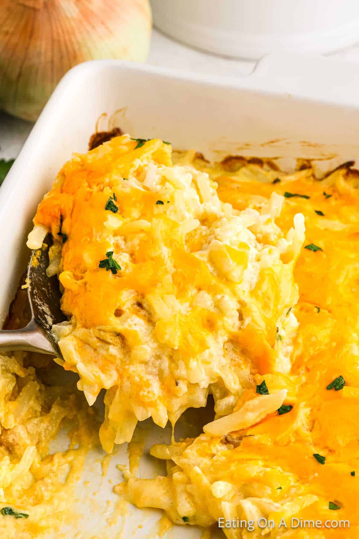 Cheesy potato casserole in a baking dish