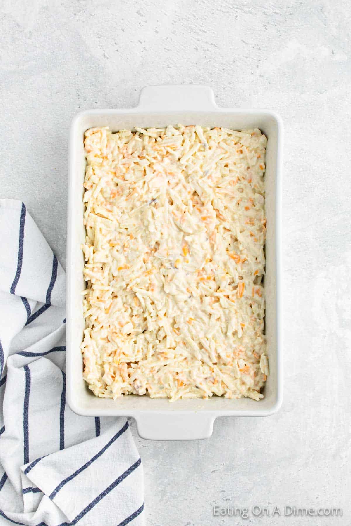 Spreading the potato casserole in the baking dish