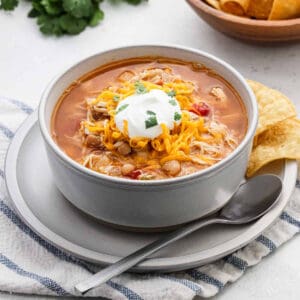 Chicken Taco Soup in a bowl topped with sour cream.