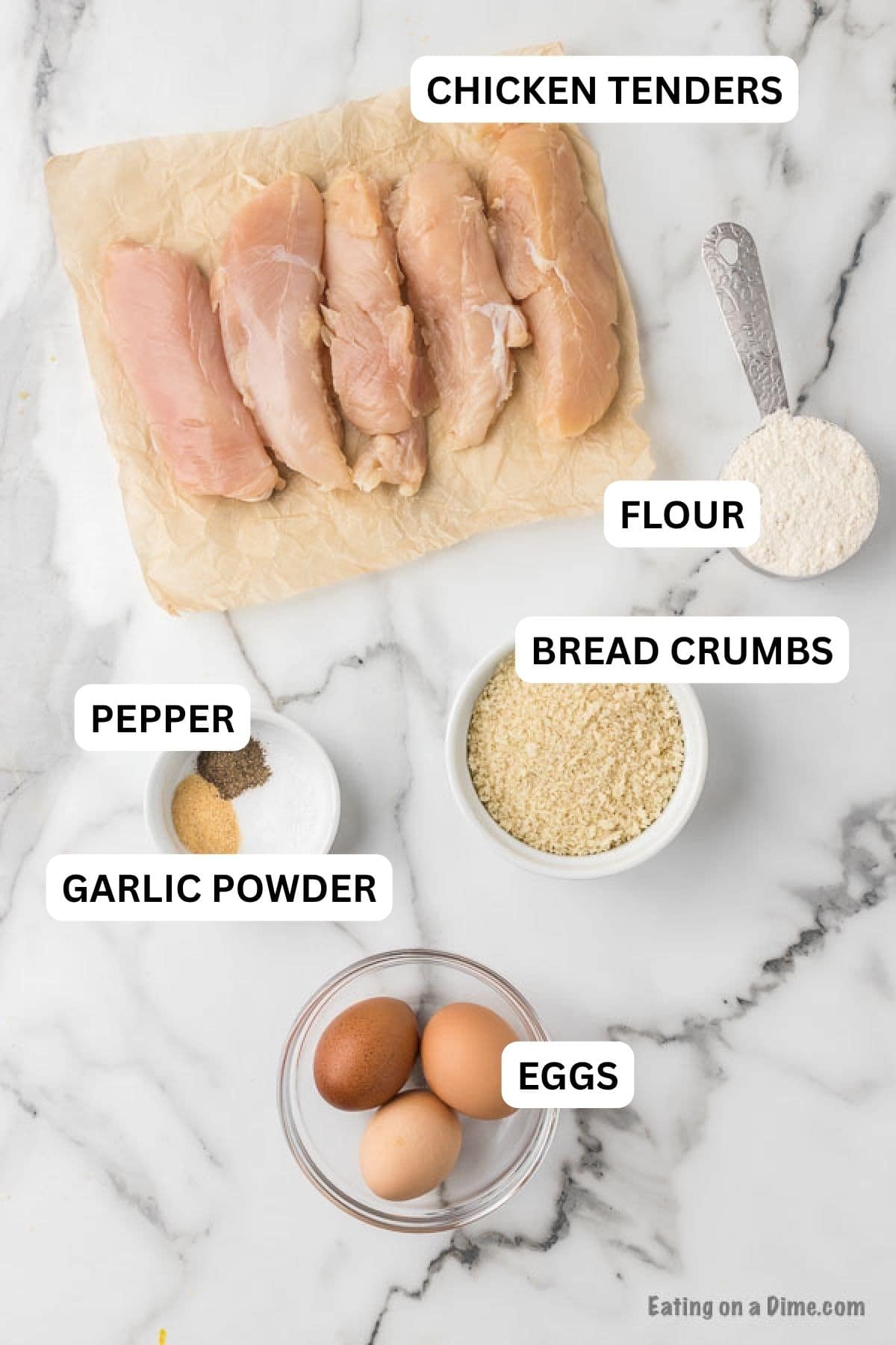 Ingredients required to make the recipe. Includes chicken tenders, flour, breadcrumbs, seasoning and eggs.