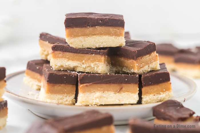 Close up image of stacked twix bars on a plate. 