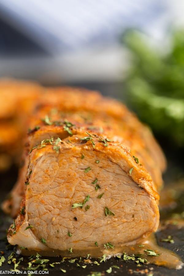 Sliced Pork Tenderloin topped with fresh chopped parsley 