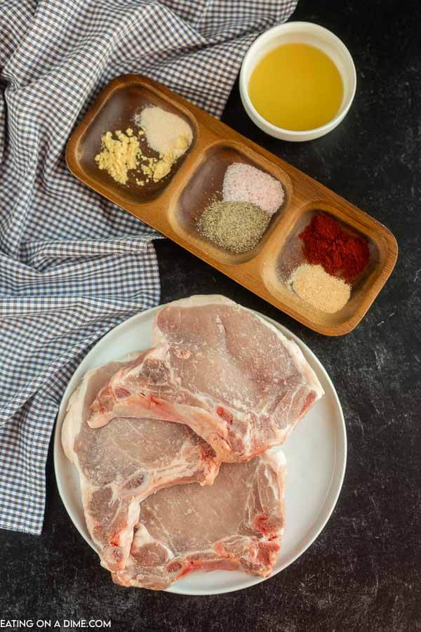 Ingredients needed for Air Fryer Bone-in Pork Chops - Bone-In pork chops, paprika, salt and pepper, ground mustard, onion powder, garlic powder, olive oil 