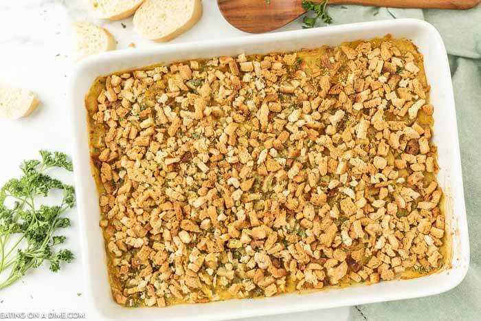 Chicken stuffing bake in white casserole dish. 