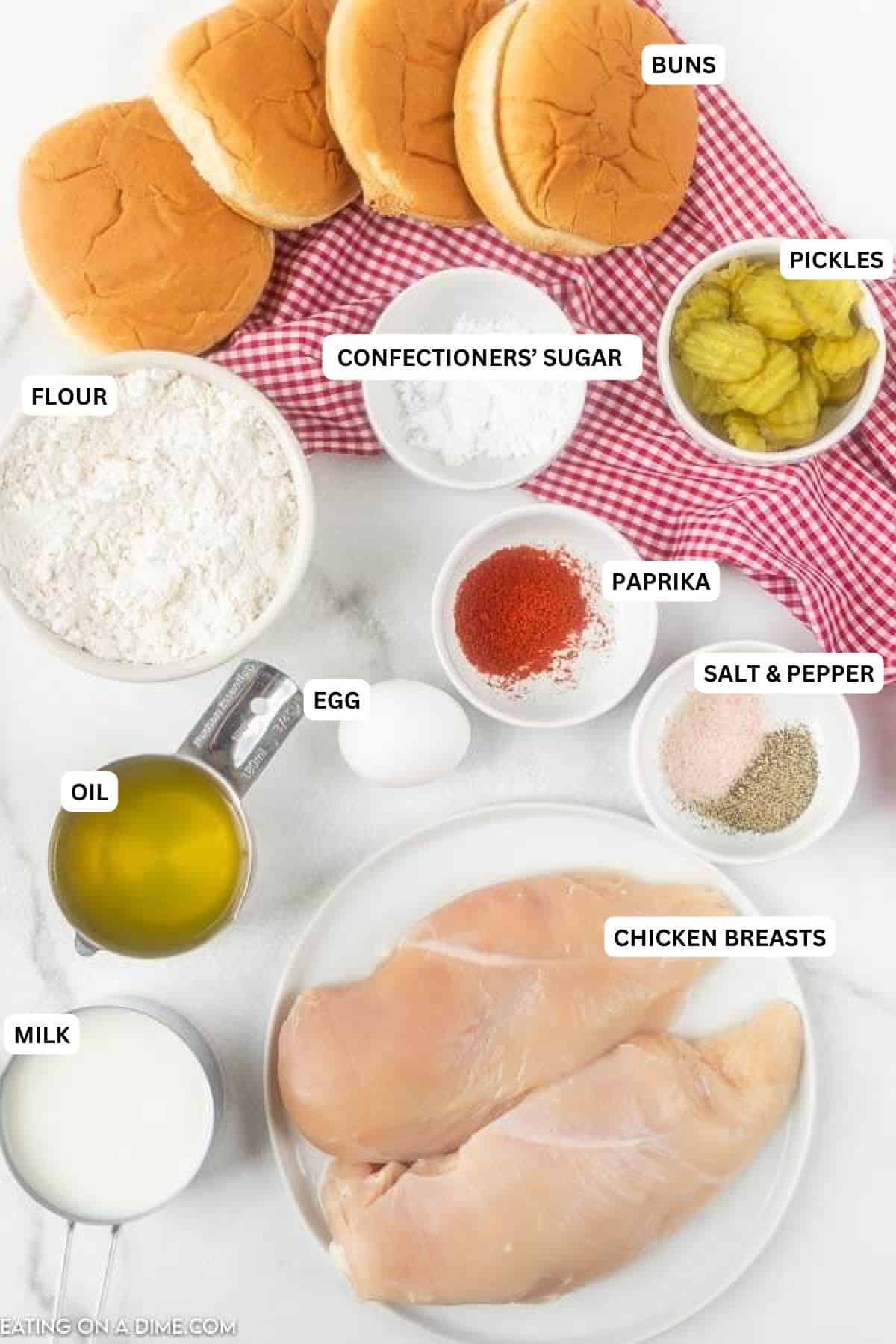 Ingredients for recipe: buns, pickles, confectioners' sugar, flour, paprika, salt, pepper, egg, oil, chicken breasts and milk.