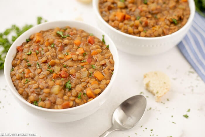 Close up image of lentil soup in a white bowl