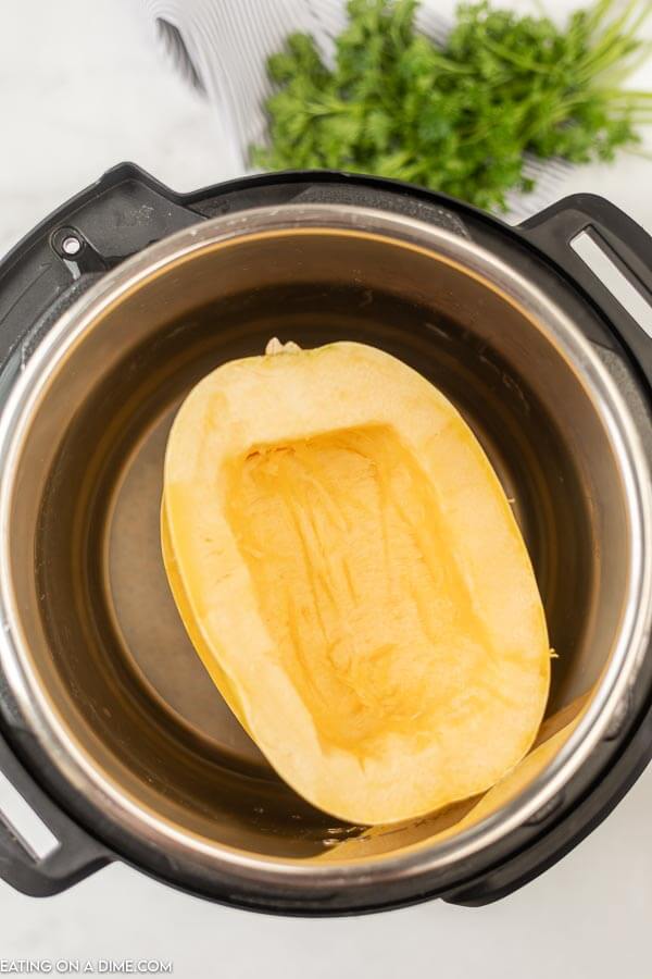Close up image of uncooked spaghetti squash in the instant pot. 