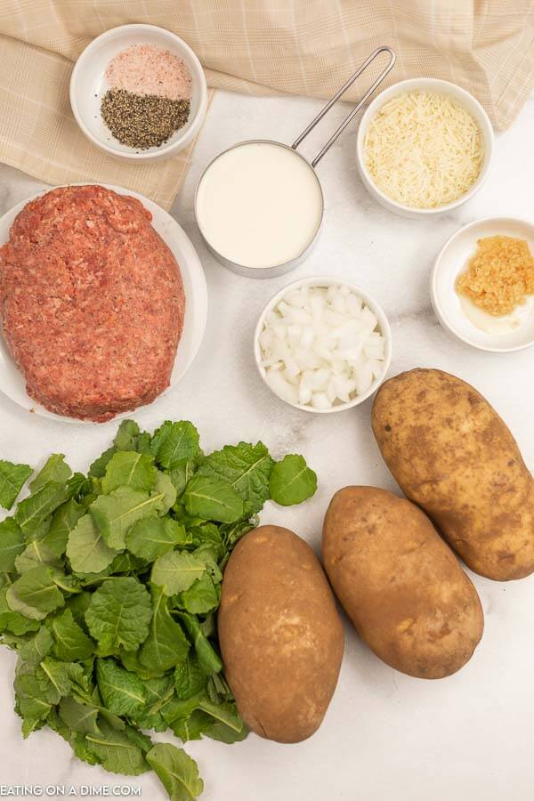 Ingredients for recipe: ground Italian sausage, seasonings, potatoes, kale, onion, whipping cream. 