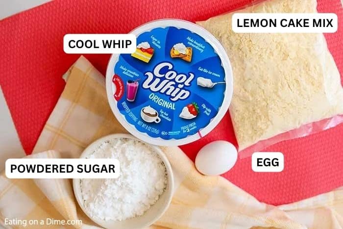 These easy Lemon Cake Mix Cookies are delicious! Just 4 ingredients to make Lemon Crinkle Cookies with cool whip. You'll love this recipe for lemon cookies using a cake mix! I love easy dessert recipes. #eatingonadime #dessertrecipes #cookierecipes Ingredients for recipe: lemon cake mix, cool whip, powdered sugar and egg.