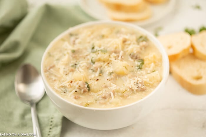 Close up image of white bowl of Zuppa Toscana Soup.