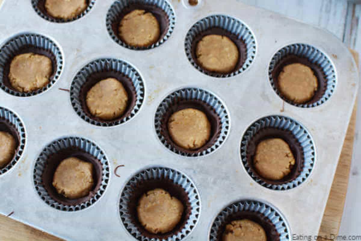 Mixture divided into muffin tins.