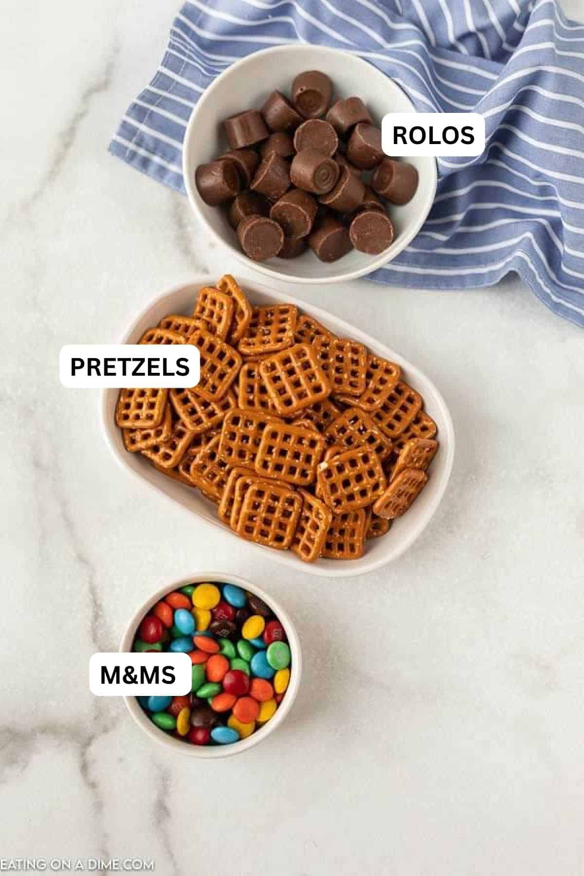 Ingredients for recipe: M&M's pretzels and Rolo candy.