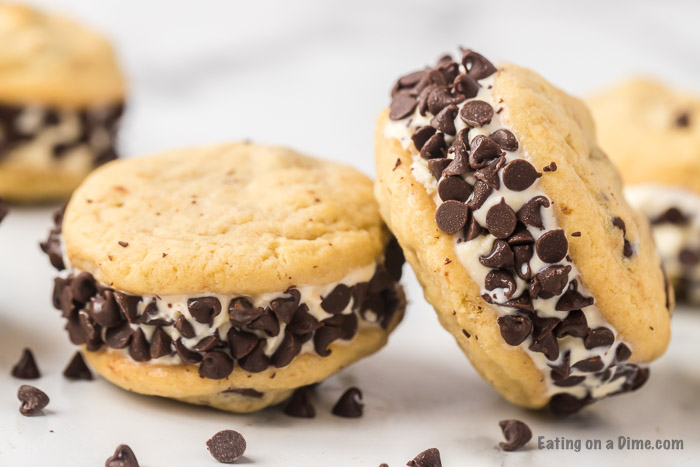 Close up image of two chocolate chip ice cream sandwiches. 