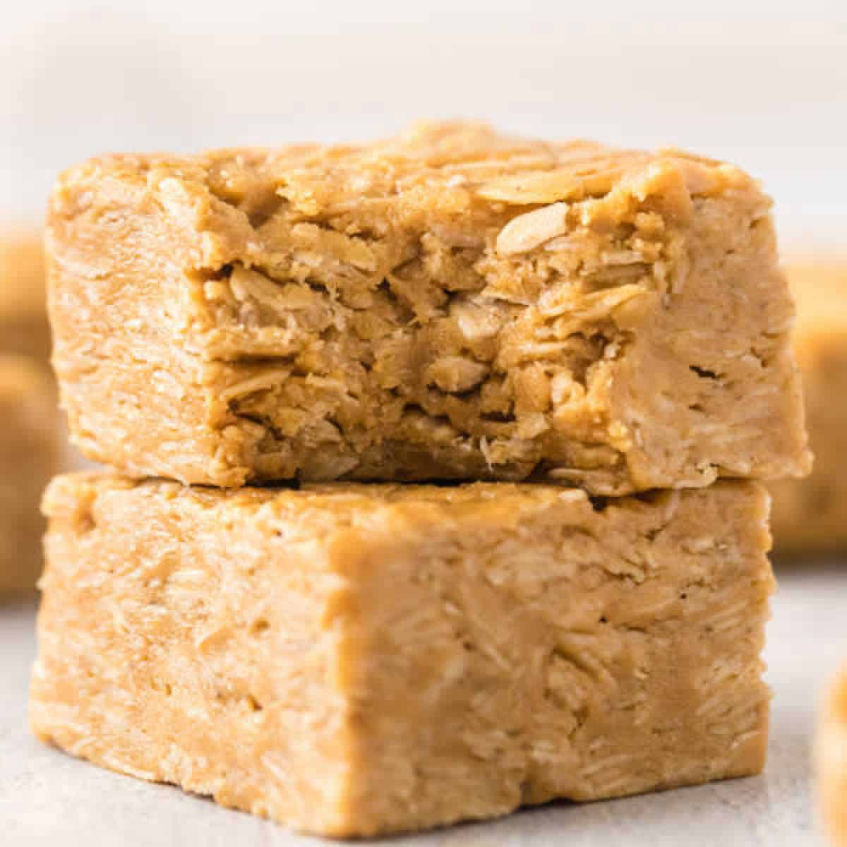 Close up image of Peanut Butter Oat Bars stacked. 