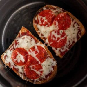 French Bread Pizza in the Air Fryer topped with melted cheese and slice pepperonis