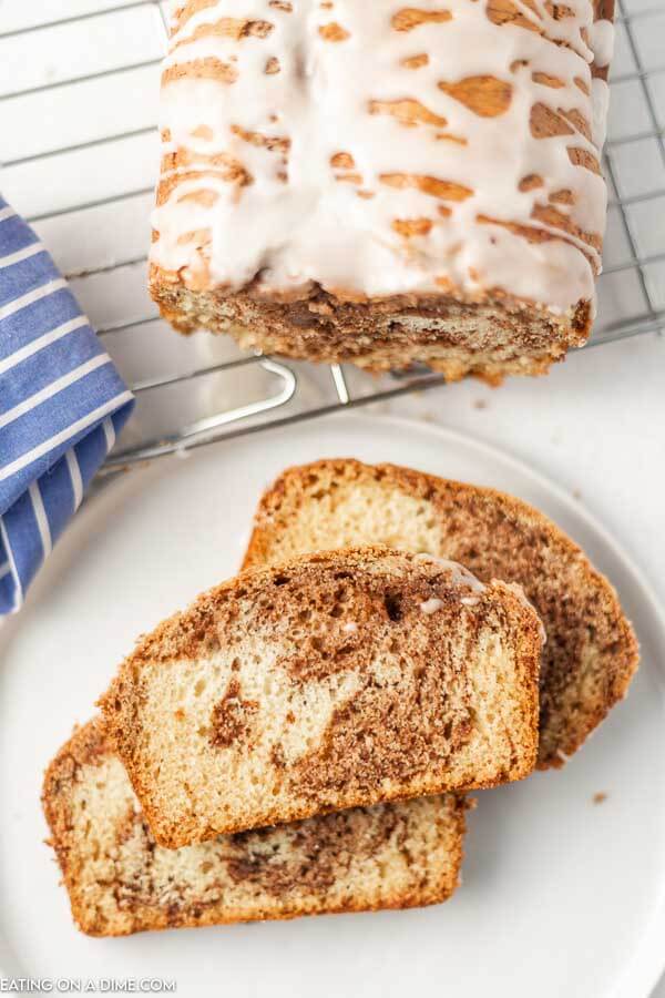 Close up image of slices of cinnamon bread on a white plate. 