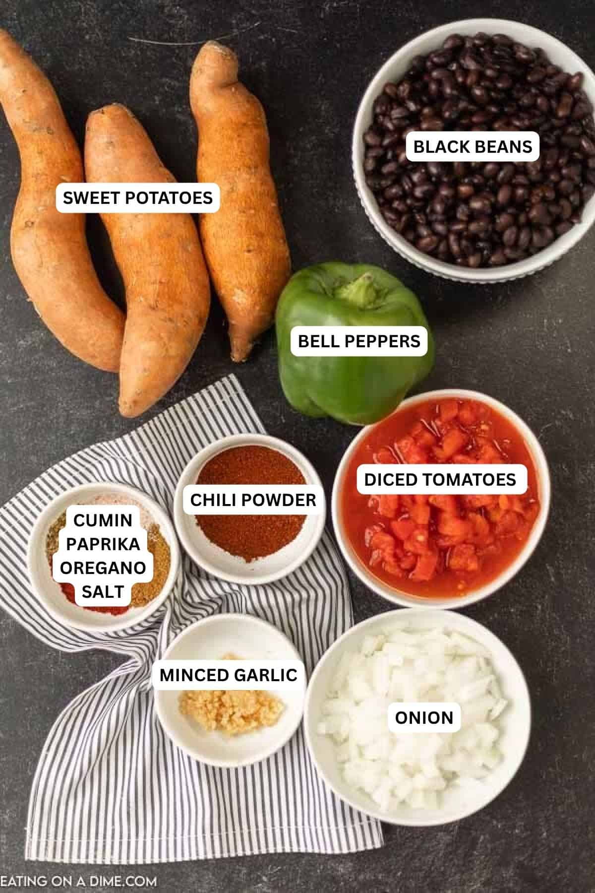 Crock Pot Sweet Potato Black Bean Chili is the perfect meal to serve on Meatless Monday or any day of the week. This chili is hearty and delicious. Ingredients for recipe: onion, minced garlic, diced tomatoes, chili powder, cumin, paprika, oregano, salt, bell peppers, sweet potatoes and black beans.